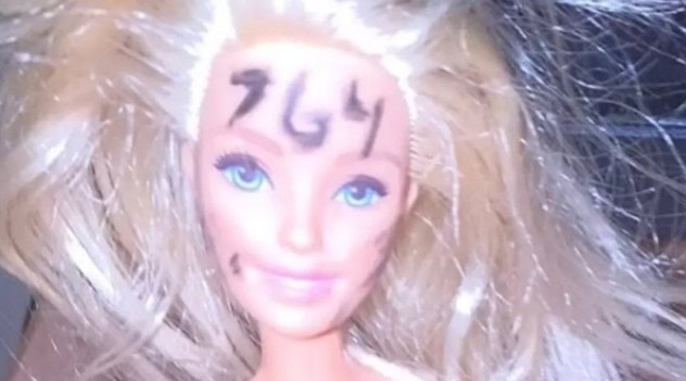 A photo of a nude barbie with “764” on its forehead taken by a teen victim of the sextortion network. Vernon Police Department)