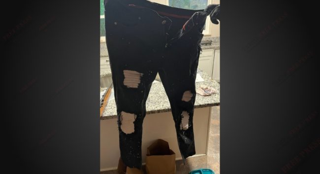 Distinctive ripped pants worn by the robber, found in the defendant’s home (DOJ)